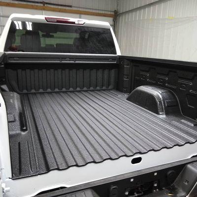 White truck with Black Spray On Bedliner by U.S. Linings.