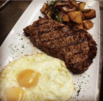 Ribeye Steak and eggs could Medium the way I liked it, Sunny side up eggs and served with some delicious country potatoes