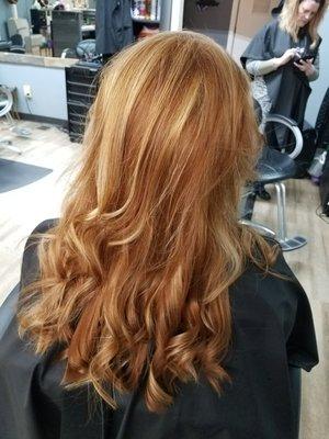 Gorgeous natural red hair enhanced with soft gentle highlights.