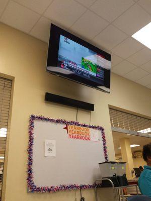 Jim Cantore, Weather Channel, on one screen in the cafeteria; National Tresure, on the other screen.