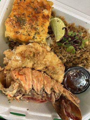 Crack Lobster- 8oz spiny lobster fried in seasoning with a specialty house seasoning served with the rice of the day and a side