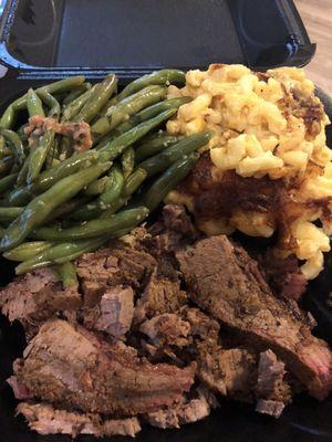 Brisket with garlic greens beans and baked truffle Mac and cheese