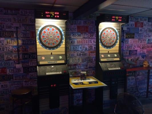 Dart boards with license plate wall