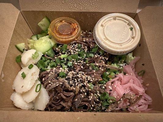 Wagyu Beef Rice Bowl with cucumbers and pickled onions