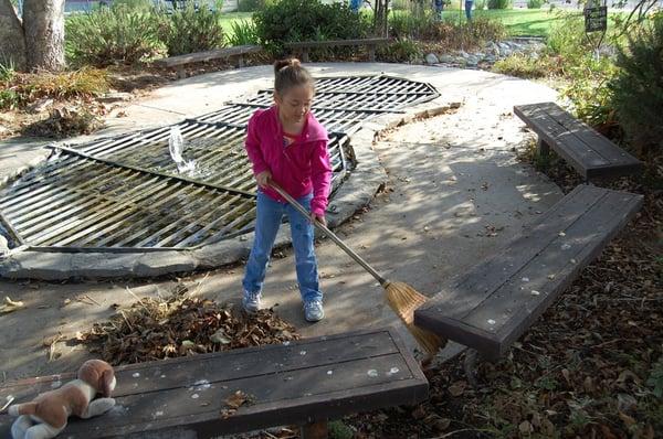 Garden clean up day with covered pond behind