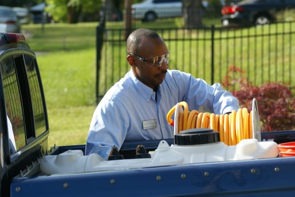 A technician setting up the termite rig.