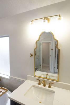 Remodeling project after water damage restoration. sink mirror and lighting upgrade