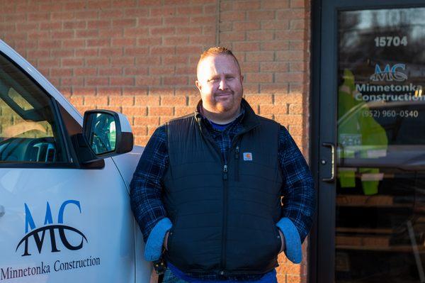 Project Manager Brad Ramirez in front of Minnetonka Construction offices in Wayzata MN.