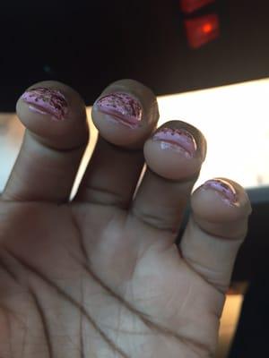 This is how the "technician" did my nails . He literally painted over the skin and then attempted to clean up afterwards.