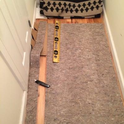 Cutting down a rubber rug pad to fit a hallway runner. Got the cutter from 433 Hardware Supply. Solid recommendation.