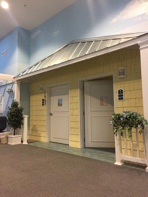 This is a view of the entrances into two of the rooms. It's decorated with calming beach decor.