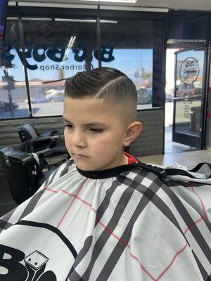 Mid fade combover with a part line