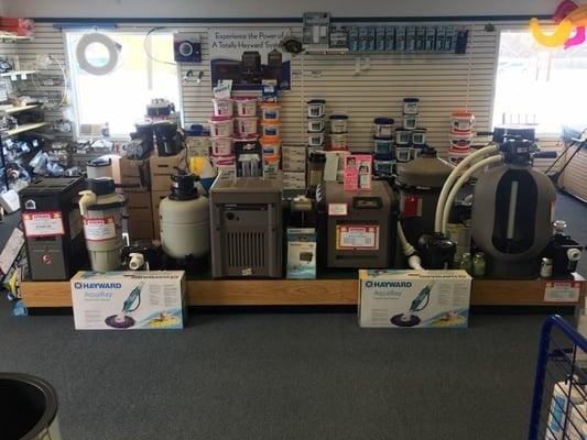 Demo stand of all stock pool pumps, filters, and heaters, Stop in today!