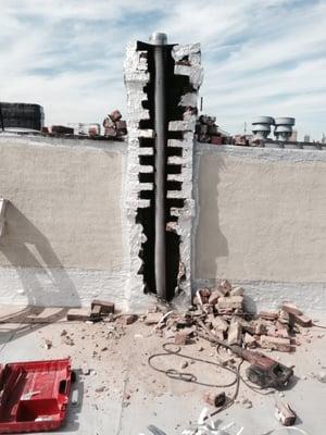 Chimney Liner Installation after breaching the chimney from the outside