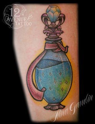 Magic in a bottle color arm tattoo by Nina Gaudin of 12th Avenue Tattoo in Nampa, Idaho!