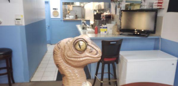 Bob the Raptor says "Sea prey in the kitchen!"