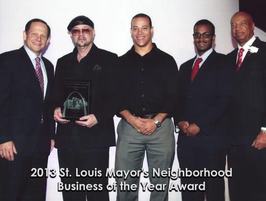 Attorney J. Justin Meehan, with Attorneys John Meehan and Abdul Mohamed receiving the award from mayor Francis Slay.