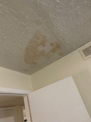 Water damage from second floor apartment bathroom