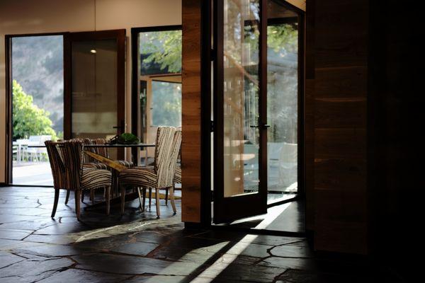 Dining room with black Indian slate floor.