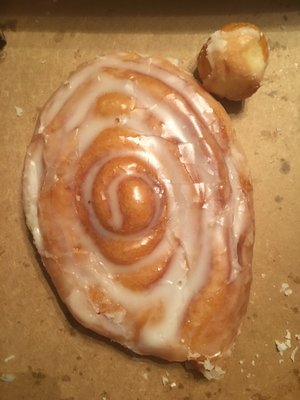 Always fresh, fast and friendly service.   (Donut hole shown next to Cinnamon Roll to show size)