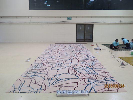 Last stage of a Custom Rug being made in Thailand.