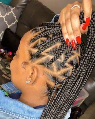 Medium Knotless Braids with Triangle Parting.