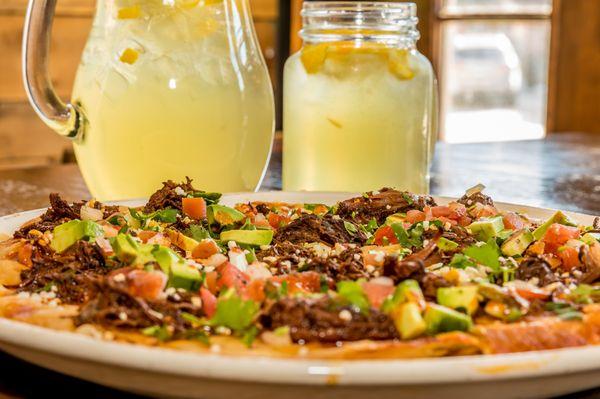 Two signature items in one picture: White Sangria and Braised Short Rib & Avocado Crisp