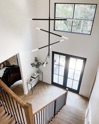 Beautiful herribone hardwood flooring installed, Pella windows, and staircase rebuild to match.