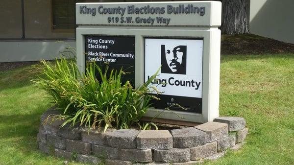 Signage right outside the front of building just a few feet from the front doors