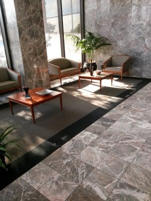 Provacatitive and comfortable building lobby showcases marble and millwork from Berlin Germany.