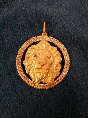 Custom 24kt gold lion head medallion.