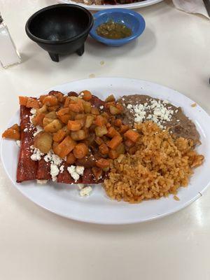 Enchiladas de Queso Fresco with rice and bean. Potatoes and carrots on top.