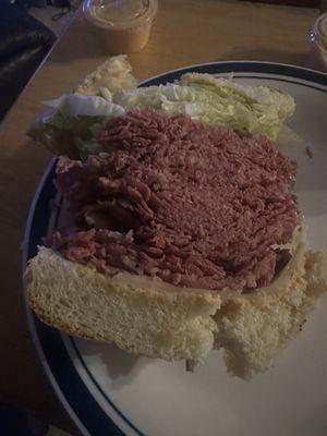 The famous Corned Beef Sandwich on onion roll no tomato. This is only half of the sandwich. This thing was massive!