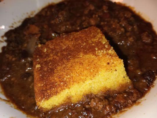 Homemade from scratch slow-simmered well-seasoned chili Daily LUNCH SPECIAL of the Day with corn bread