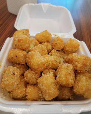 Inside Sully's itself on Coffee. Good take out service. These garlic tots are not to be missed as a side.. garlic butter goodness