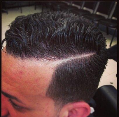 Comb over with a side part styled with Gummy hair gel. Sold here at the barber shop! Large and small sizes available