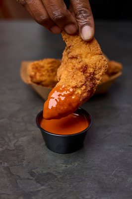 Try our air fried chicken tenders with one of our signature sauces!