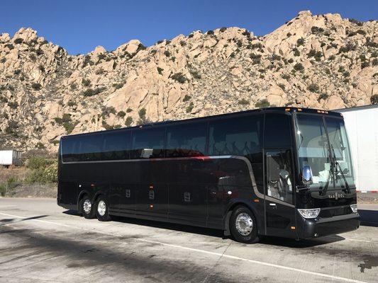 New 2019 black 57 passenger leather luxury coach.