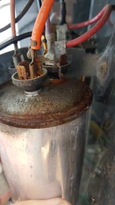 Faulty Capacitor. Notice the "puffed up" top? We changed this part on a hot Sunday morning. Customer up and running within 30 minutes!