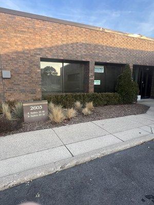 Photo showing the building number and our office in the corner.