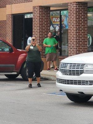 The manager with her camera . I went 2,,, 7-11  early there she  was acting her normal and bringing her $ tree employee's in  her schemes