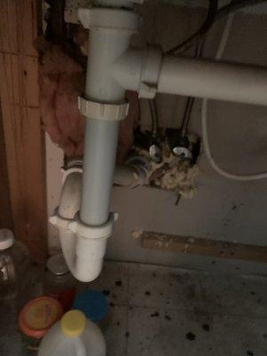 Drain under kitchen sink.