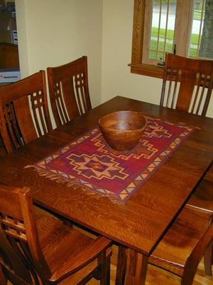 Local Amish-made custom quarter sawn oak dining room table comfortably seats six.