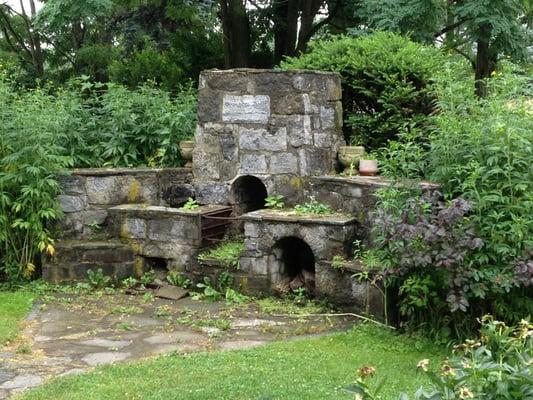 Stone fireplace in the backyard.