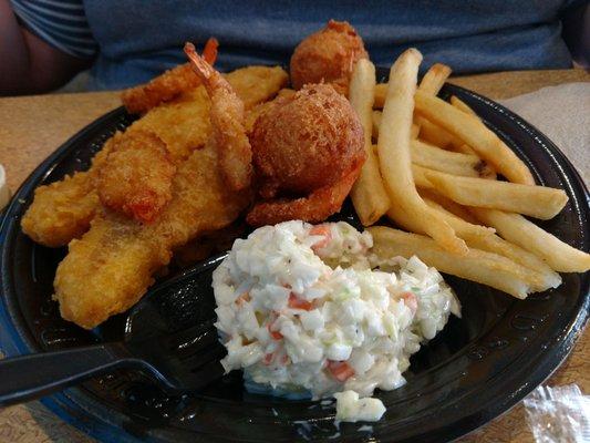 Catfish and shrimp with fries and coleslaw.