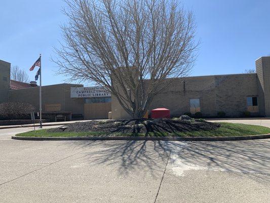 The main entry way is boarded up.