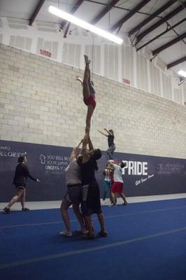 Senior Level 3 Team members practice stunting.