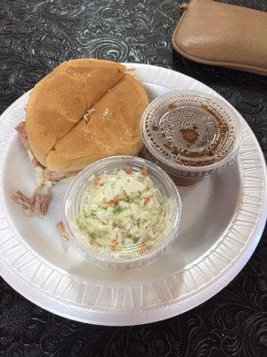 Pork roast sandwich (pulled pork) with two sides ($9)