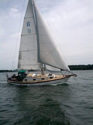 Captain Tyler Martin under sail on his boat Largo