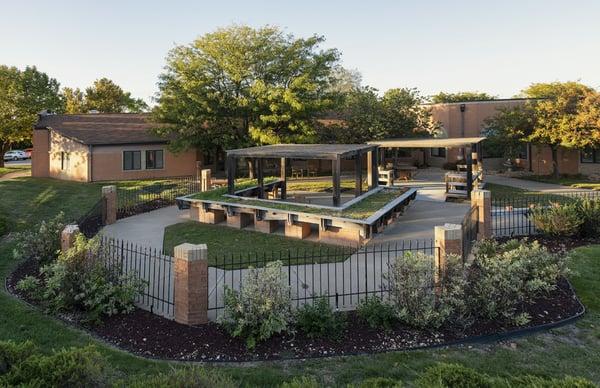 An enclosed outdoor courtyard is available for residents to enjoy time outdoors.